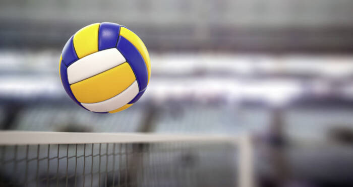 Volleyball ball and net in voleyball arena during a match. 